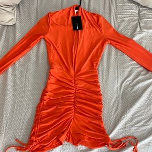 Orange “Deceiving Looks Ruched Romper” Small